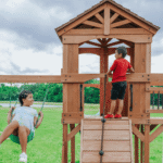 Sterling Point Wooden Swing Set With Covered Clubhouse, Slide, Belt Swings and Rock Wall - Image 2