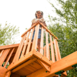 KidKraft Ridgemoor Perch Cedar Swing Set with Belt Swings, 8 ft Wavy Slide and Rock Wall - Image 4